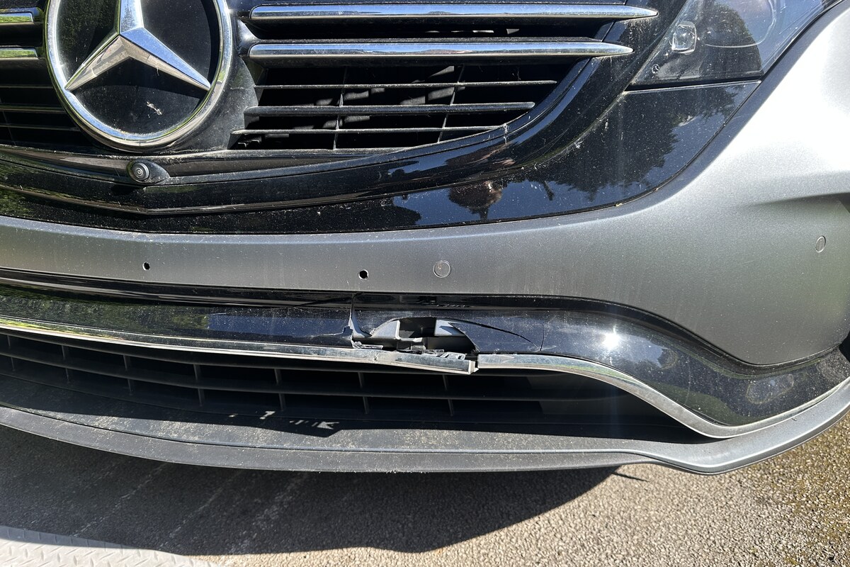 Damaged cracked Mercedes bumper before repair